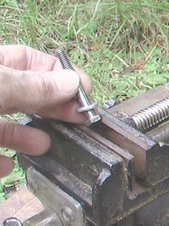 Place 1/4th inch screw in vise